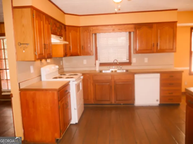 a kitchen with a stove and a sink