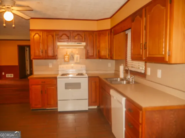 a view of storage and utility room with a window