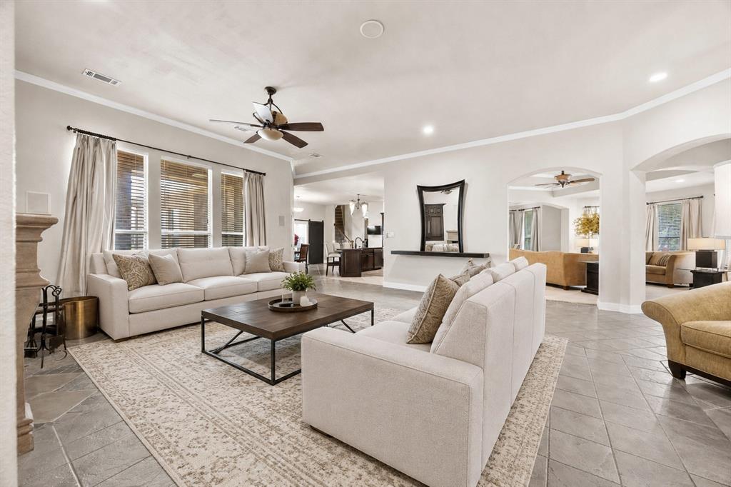 219 Mohundro Road Ferris, TX 75125 - Photo 6 of 40 a living room with furniture and a chandelier