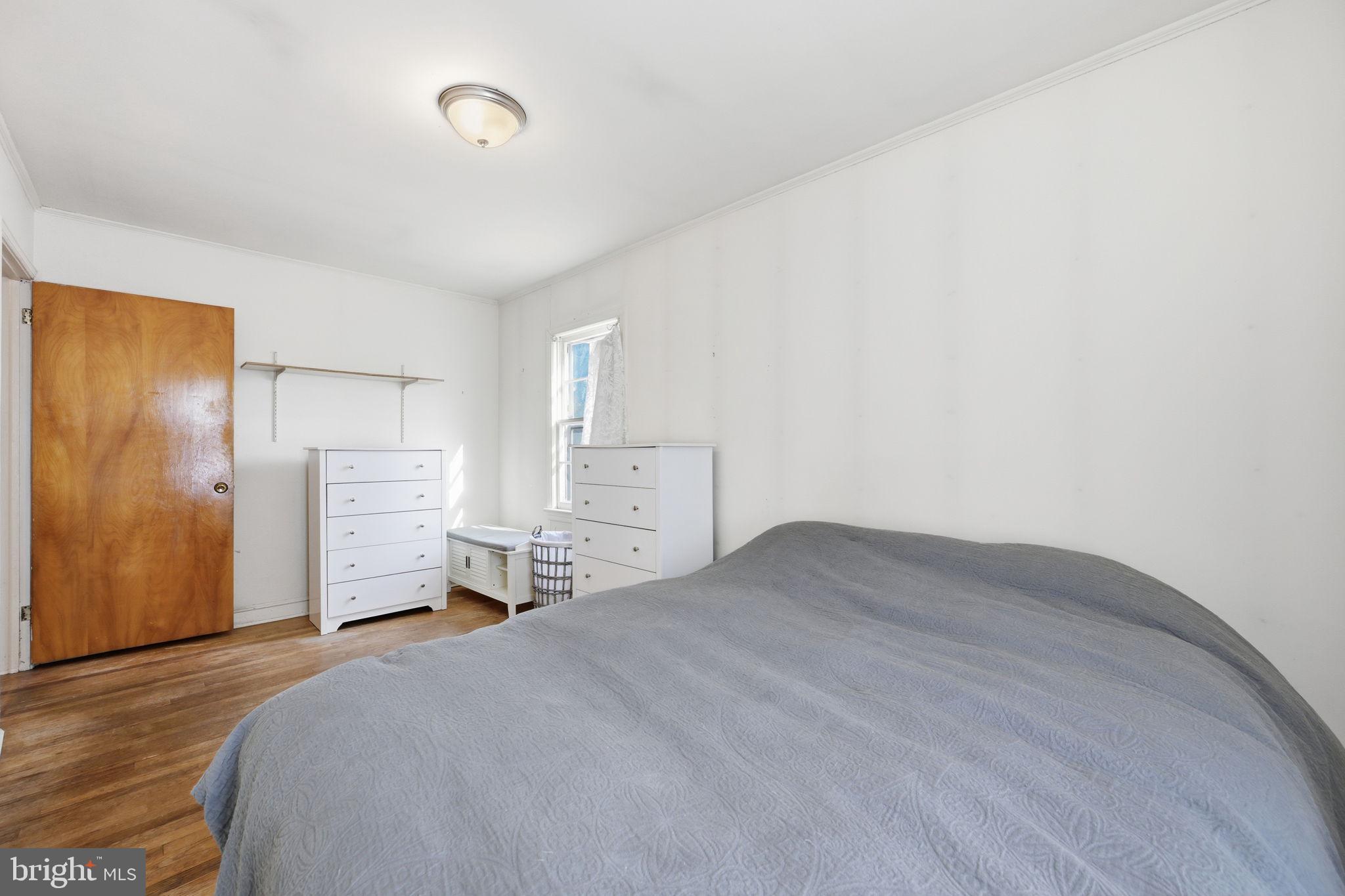 703 Northwest Drive Silver Spring, MD 20901 - Photo 13 of 25 a bedroom with a bed and closet