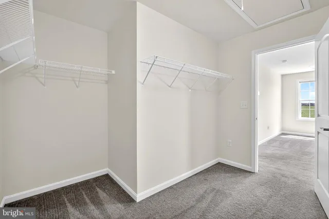 a house view with swimming pool in front of it