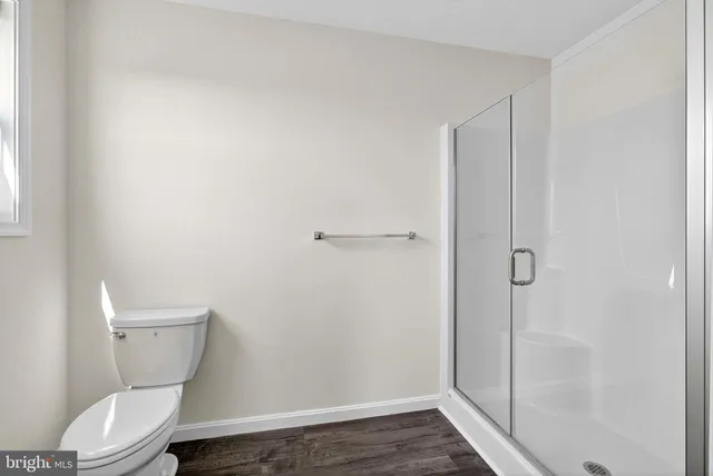 an aerial view of a house with swimming pool and a yard