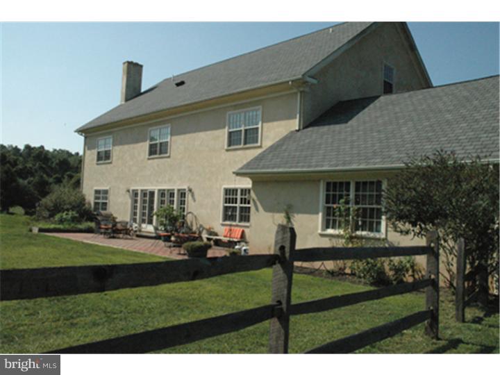 2652 North Sugan Road New Hope, PA 18938 - Photo 4 of 12 a front view of house with yard having outdoor seating