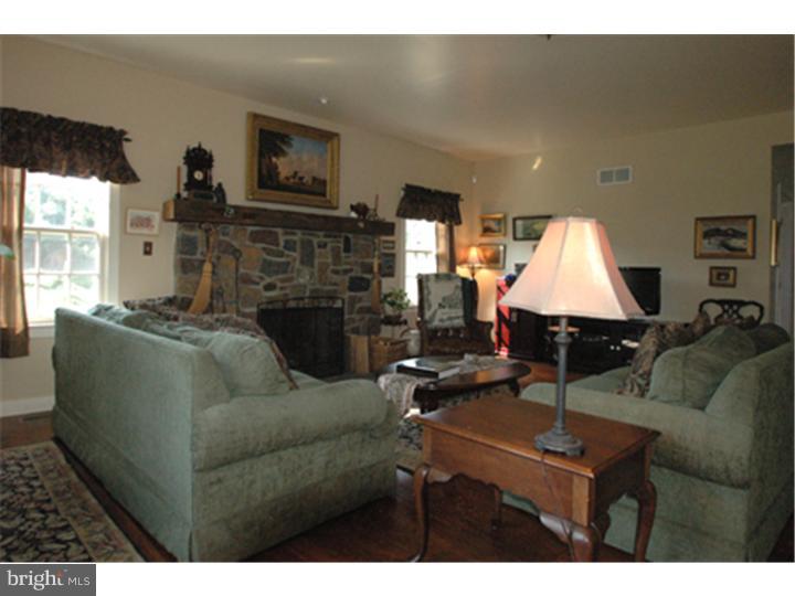 2652 North Sugan Road New Hope, PA 18938 - Photo 7 of 12 a living room with furniture and a fireplace