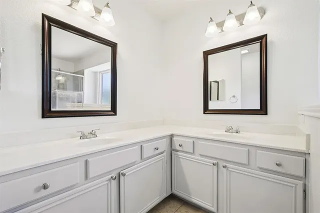 a kitchen with stainless steel appliances granite countertop a stove refrigerator and cabinets