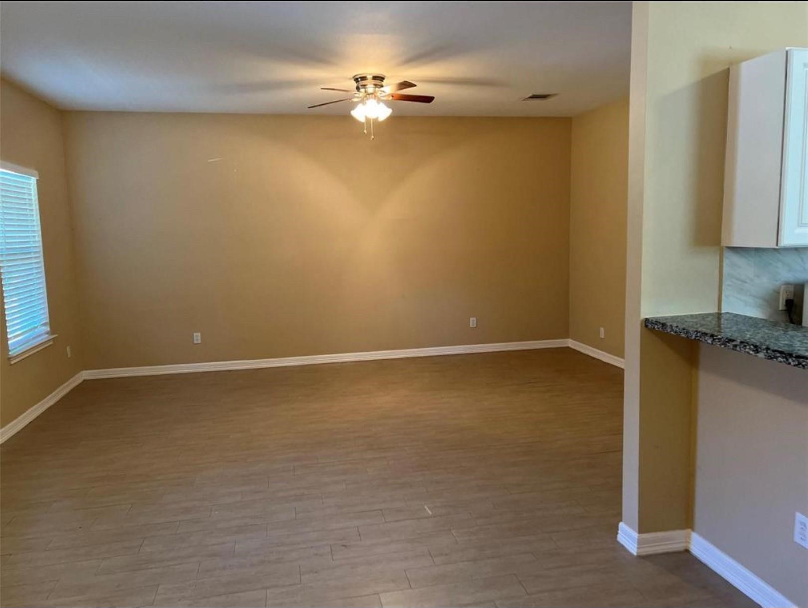 4733 16th Street Bacliff, TX 77518 - Photo 3 of 11 wooden floor in an empty room