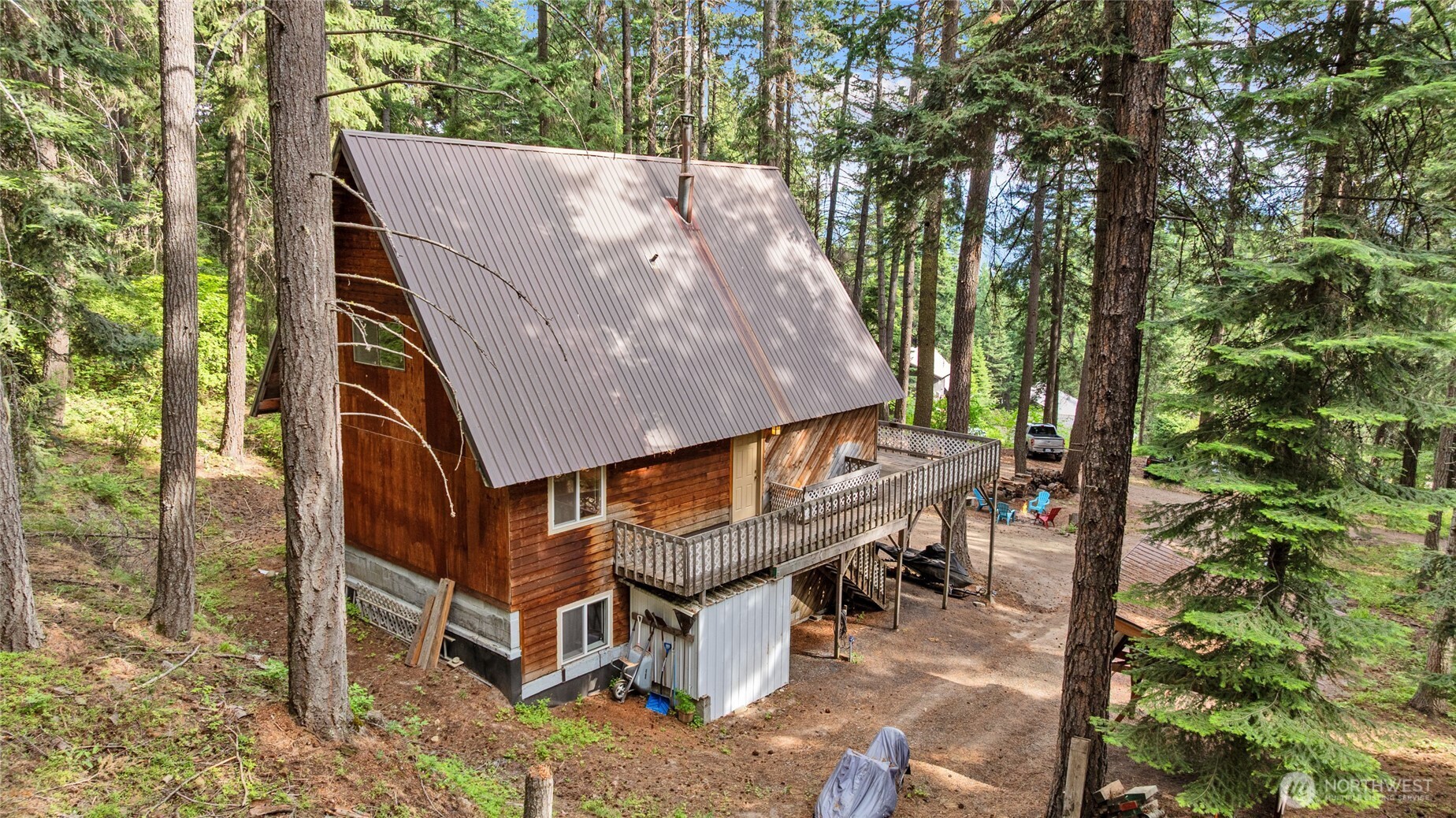 211 Indian Hill Road Cle Elum, WA 98922 - Photo 2 of 36 an aerial view of a house with backyard and trees