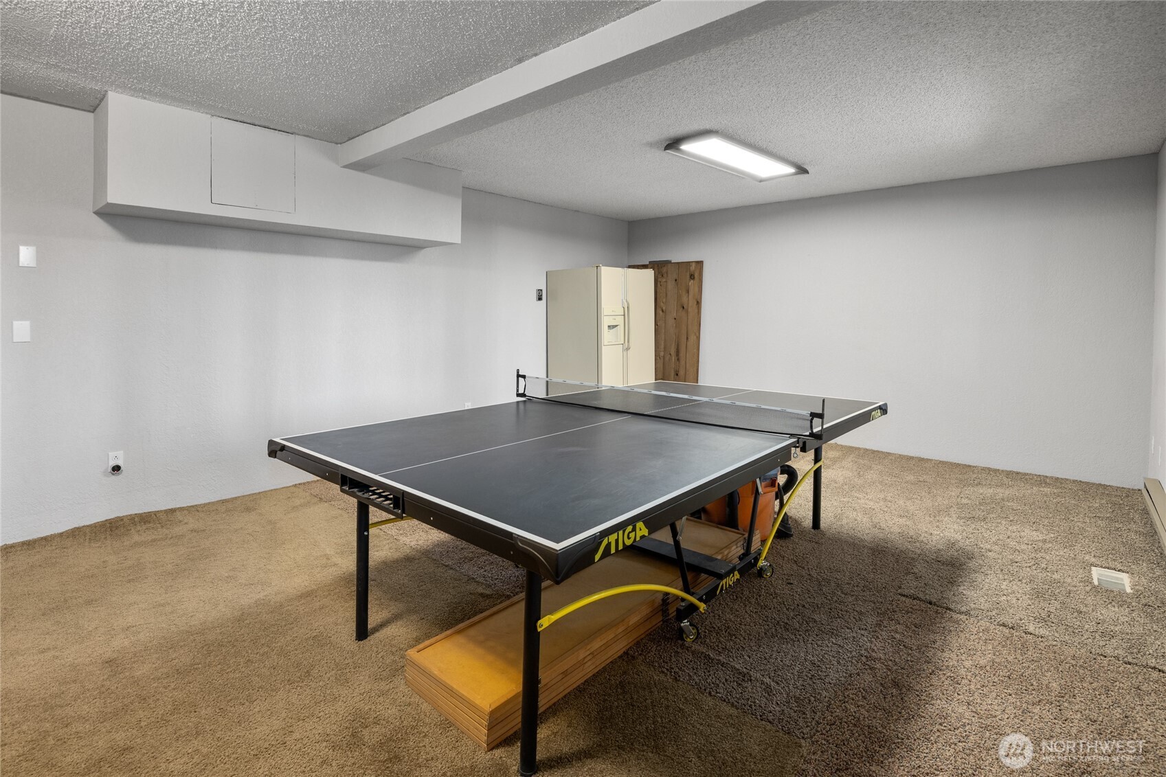 211 Indian Hill Road Cle Elum, WA 98922 - Photo 23 of 36 a room with wooden floor pool table and windows