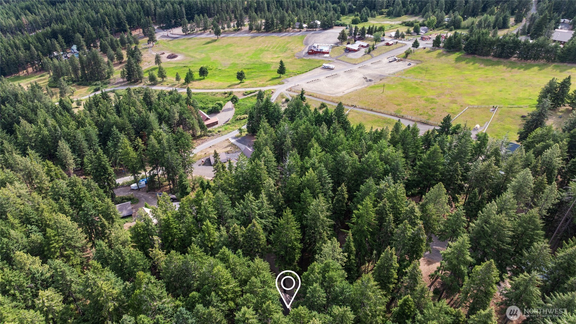 211 Indian Hill Road Cle Elum, WA 98922 - Photo 32 of 36 a view of a swimming pool with a yard