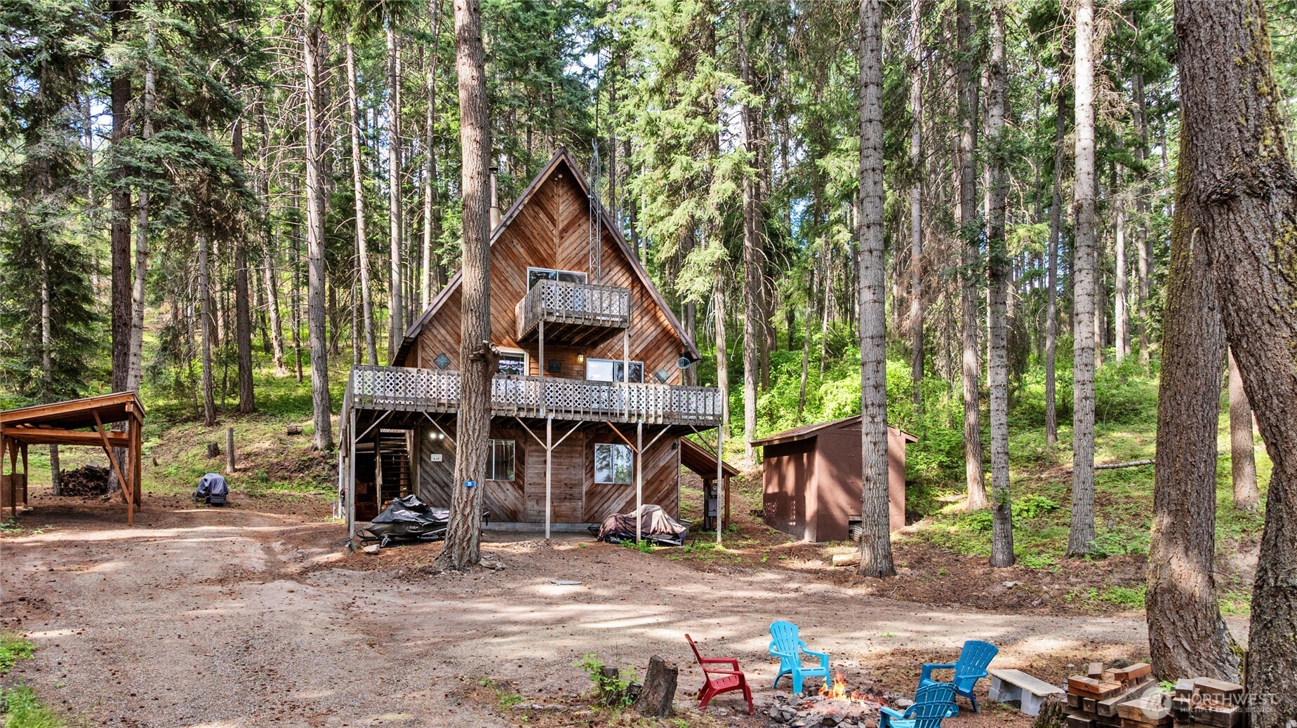 211 Indian Hill Road Cle Elum, WA 98922 - Photo 35 of 36 a view of a house with large trees and next to a road