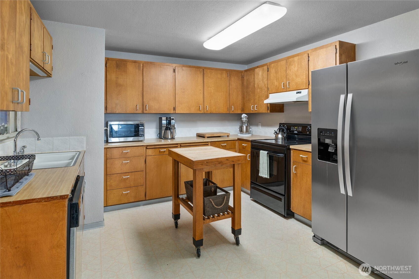 211 Indian Hill Road Cle Elum, WA 98922 - Photo 10 of 36 a kitchen with a sink a counter top stainless steel appliances and cabinets