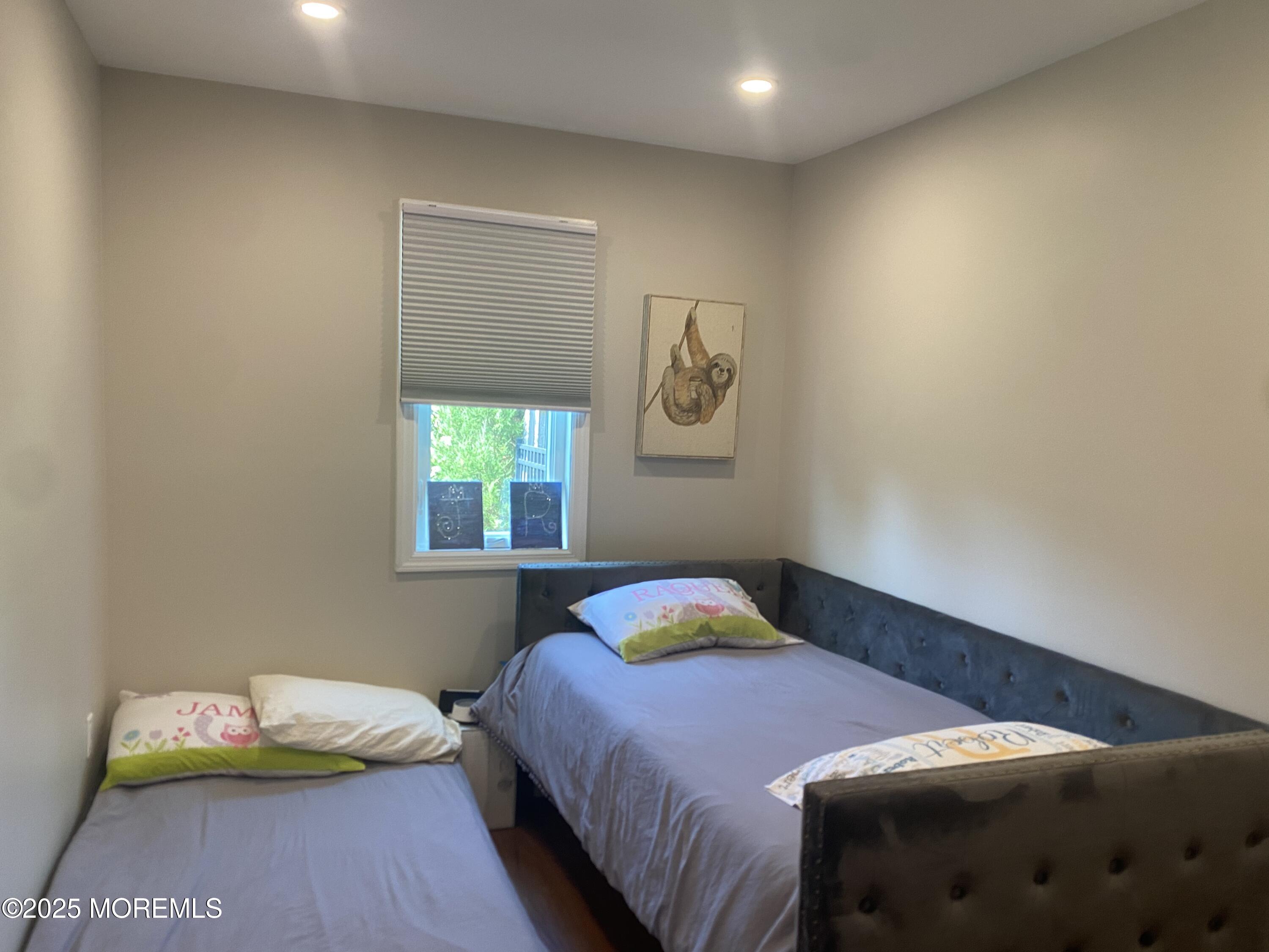 84 Forest Street West Long Branch, NJ 07764 - Photo 14 of 19 a bedroom with a bed and a window