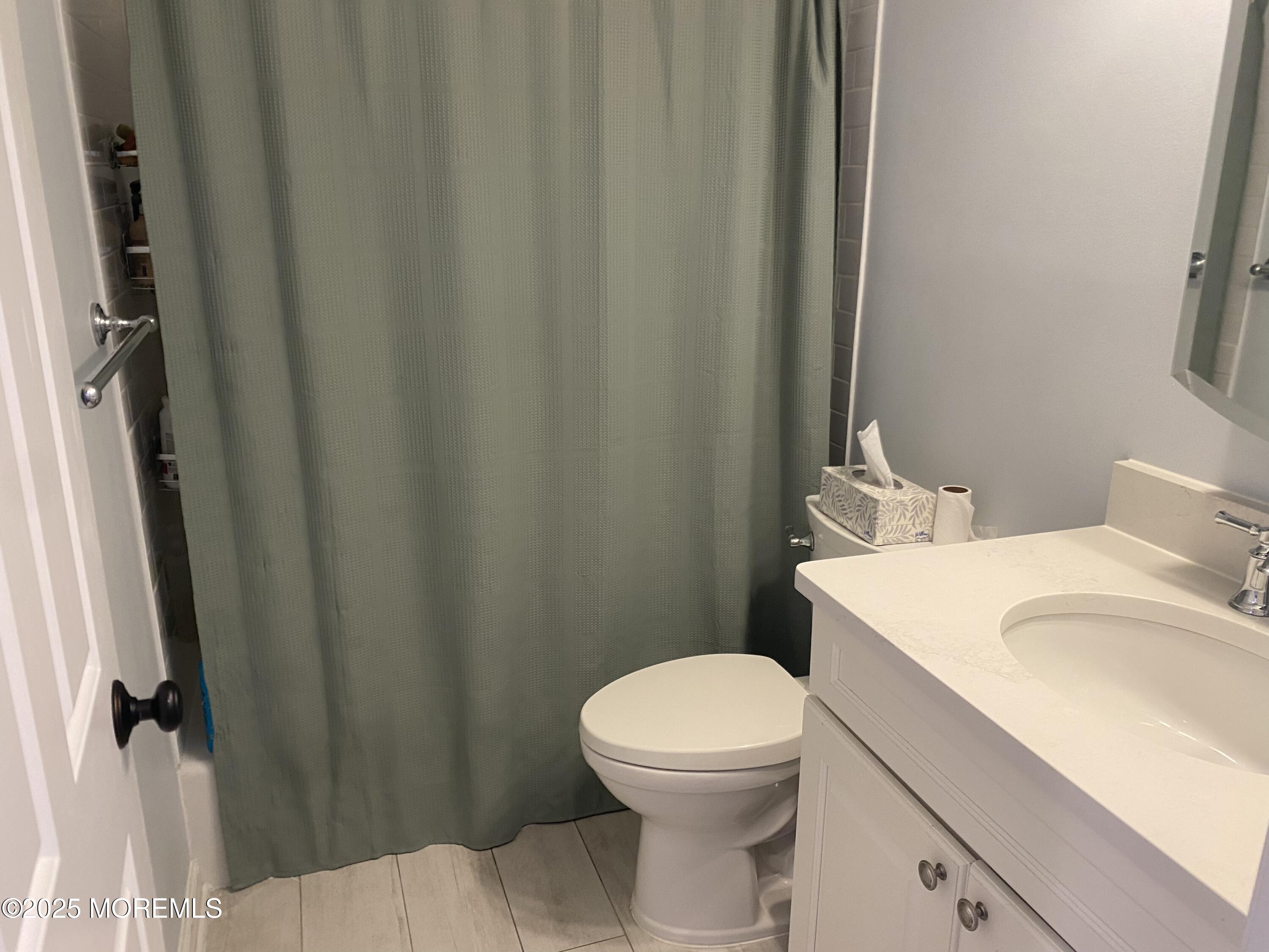 84 Forest Street West Long Branch, NJ 07764 - Photo 15 of 19 a white toilet sitting next to a bathroom sink
