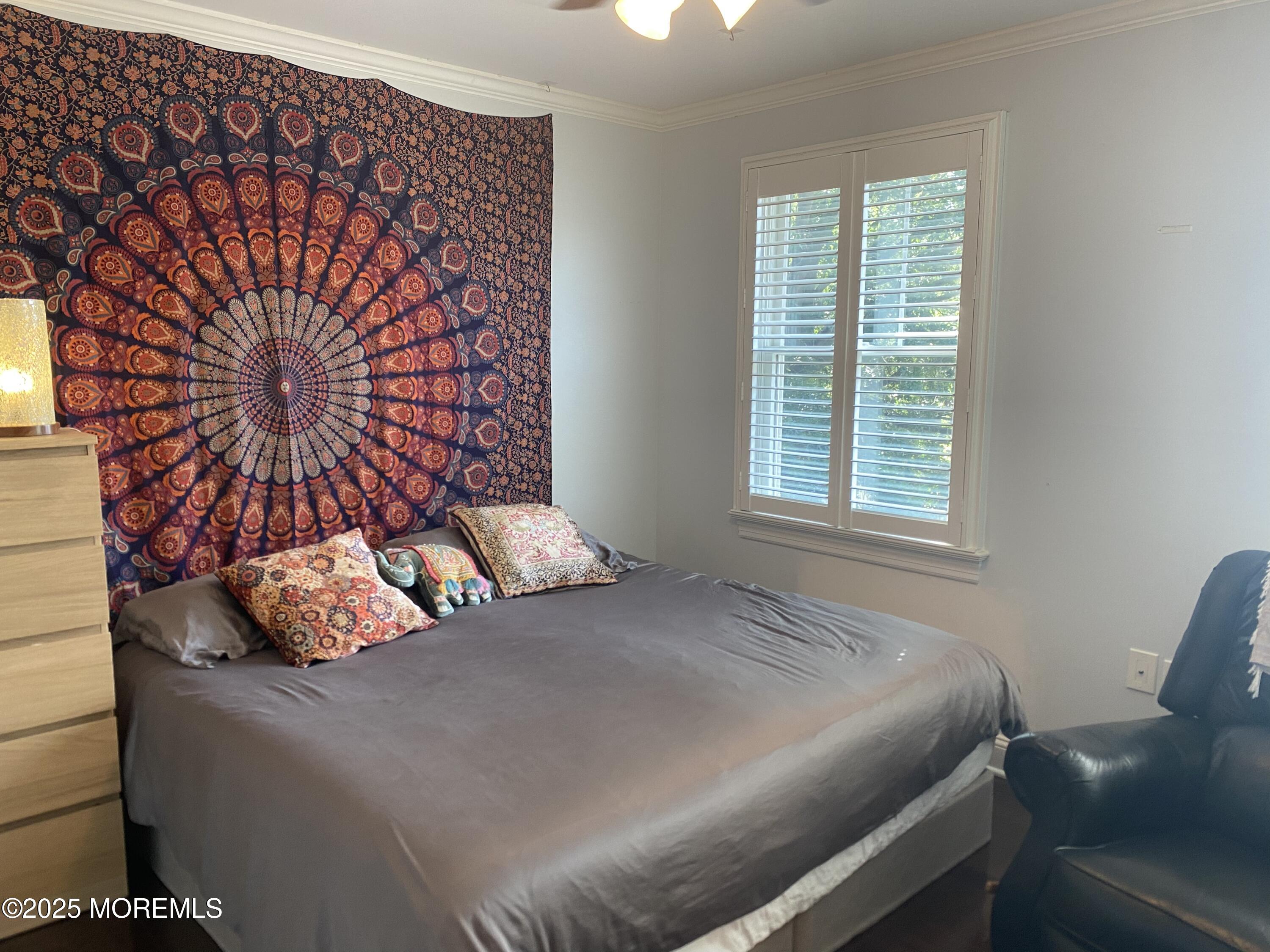 84 Forest Street West Long Branch, NJ 07764 - Photo 17 of 19 a bedroom with a bed and next to a window