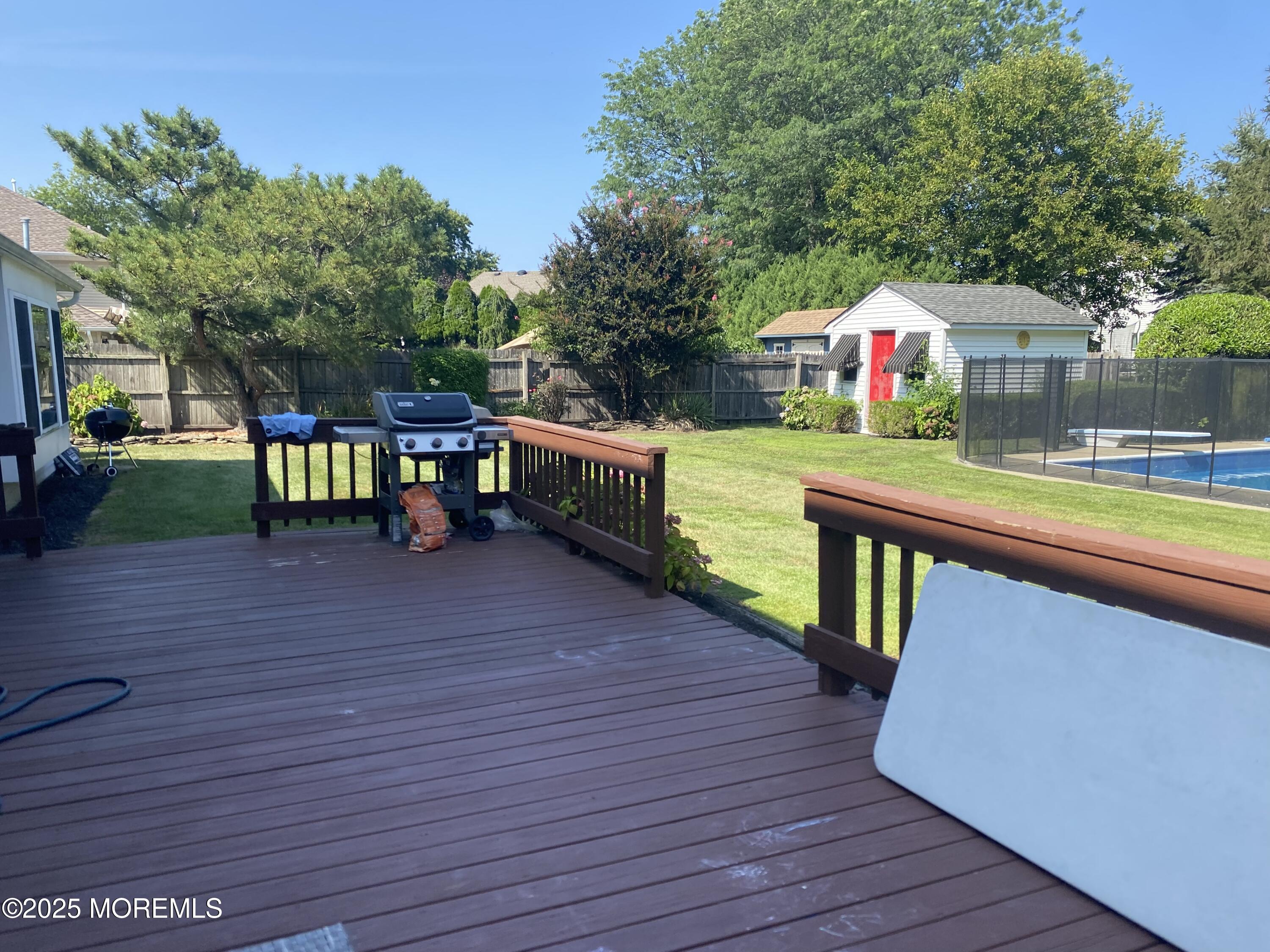 84 Forest Street West Long Branch, NJ 07764 - Photo 19 of 19 a view of a chairs and table on the wooden deck