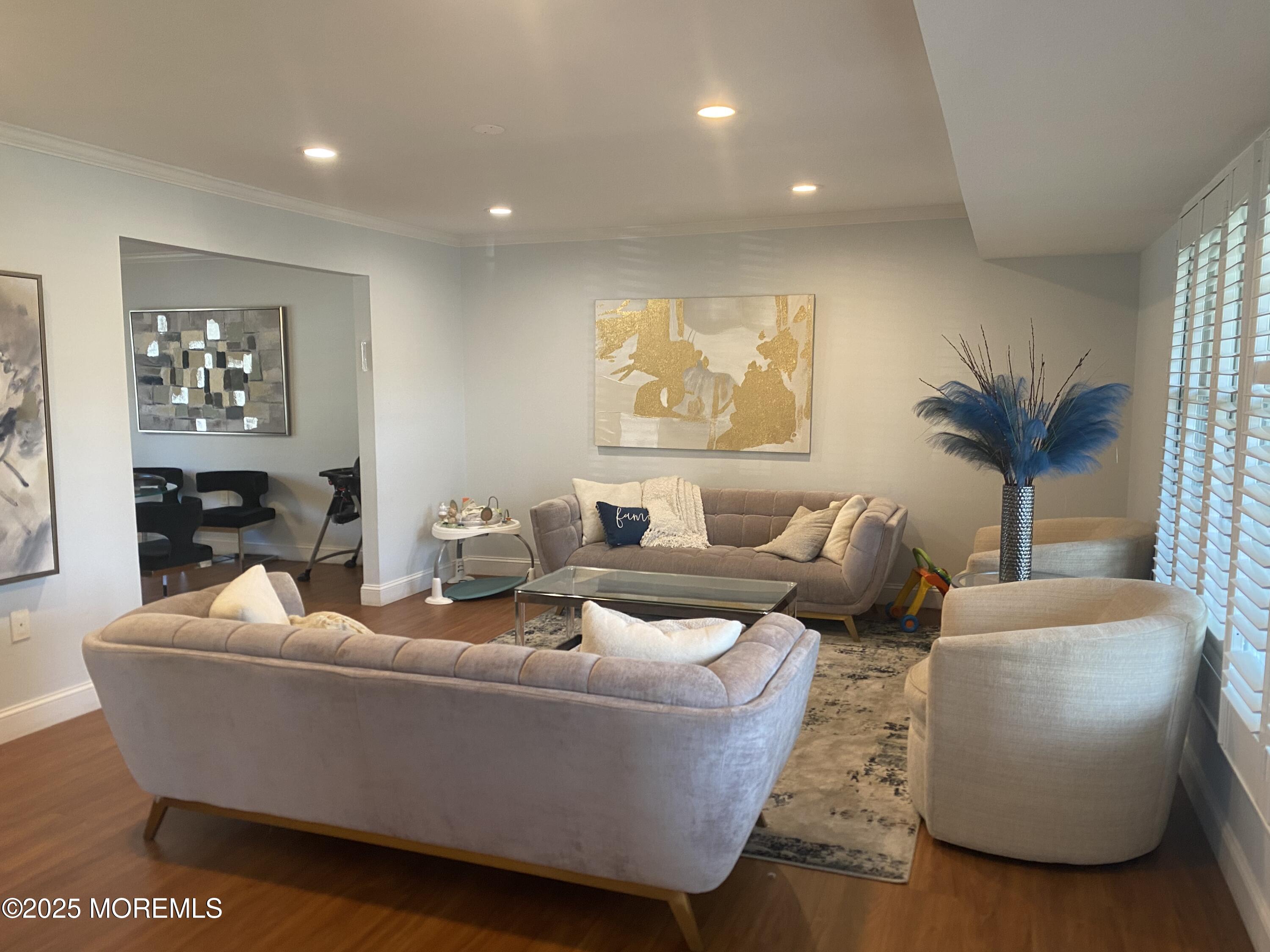 84 Forest Street West Long Branch, NJ 07764 - Photo 2 of 19 a living room with furniture and a large window