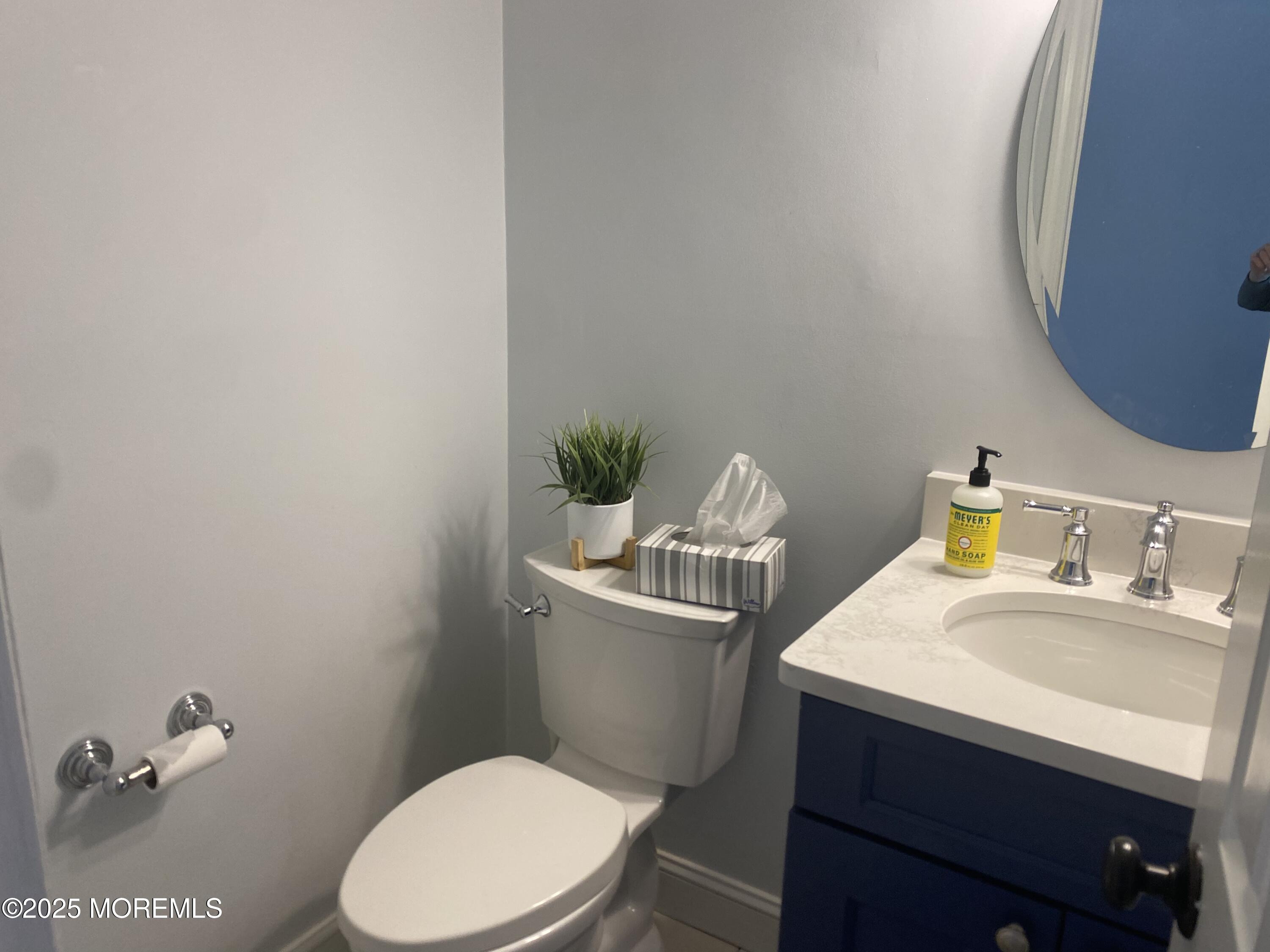 84 Forest Street West Long Branch, NJ 07764 - Photo 5 of 19 a bathroom with a sink a toilet and a mirror