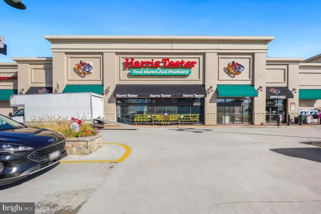 a city street lined with buildings and trees