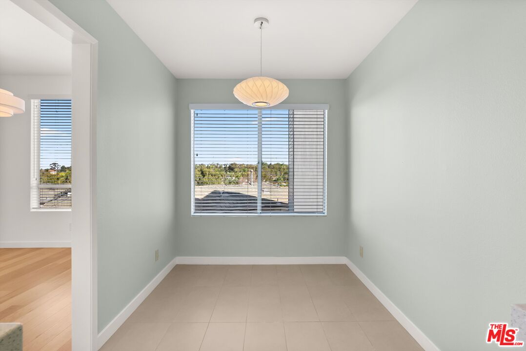4643 East 4th Street, Unit 22 Long Beach, CA 90814 - Photo 23 of 40 a view of a room with window and wooden floor