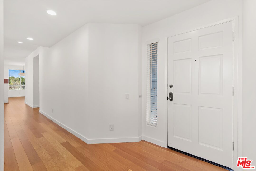 4643 East 4th Street, Unit 22 Long Beach, CA 90814 - Photo 5 of 40 a view of an empty room with wooden floor