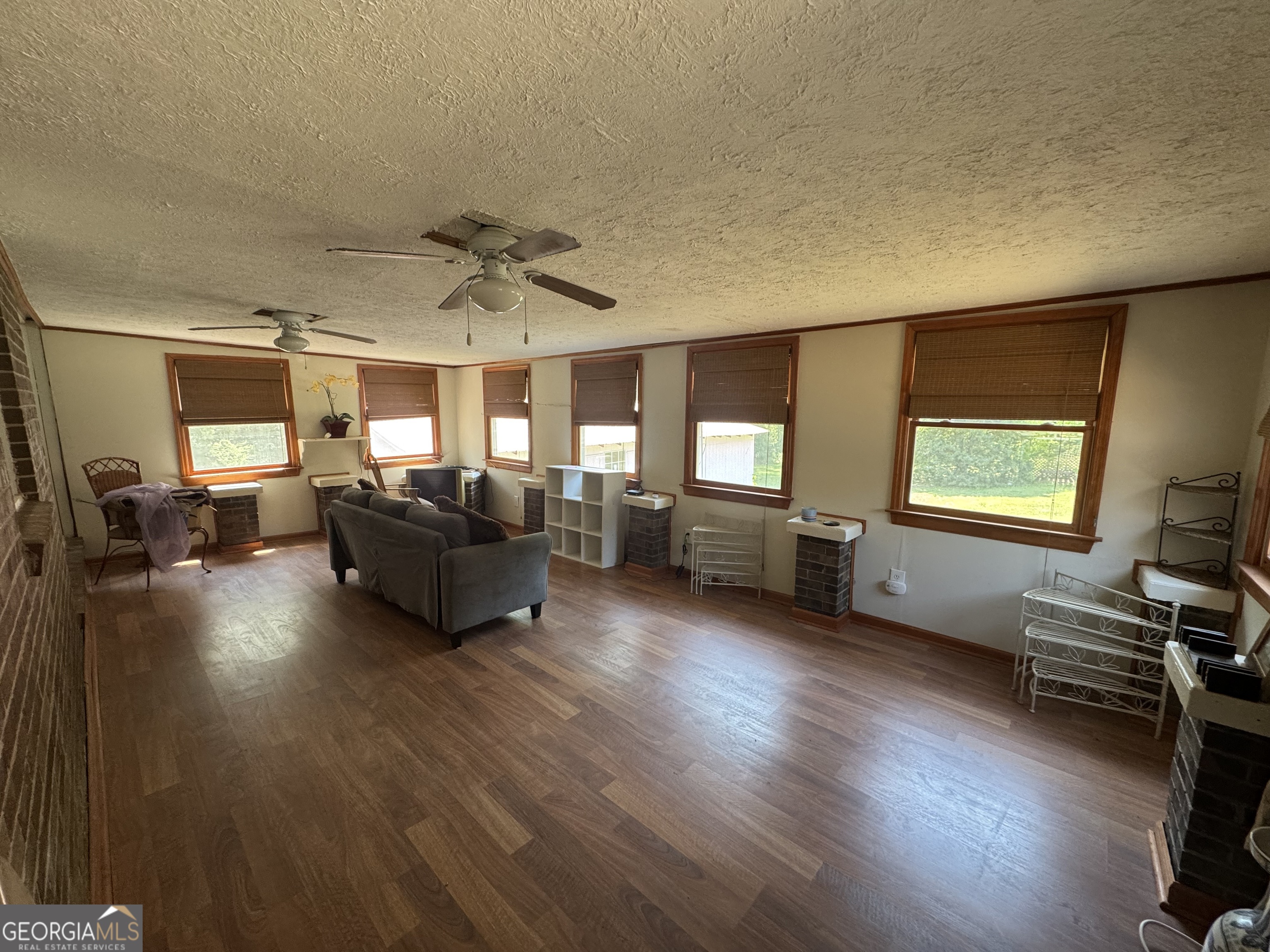 558 Old Brent Road Forsyth, GA 31029 - Photo 8 of 9 a living room with furniture and a wooden floor