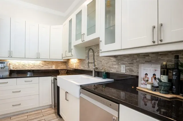 a spacious bedroom with a large bed and a large window