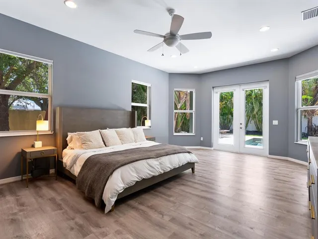 a bathroom with double sink and a mirror