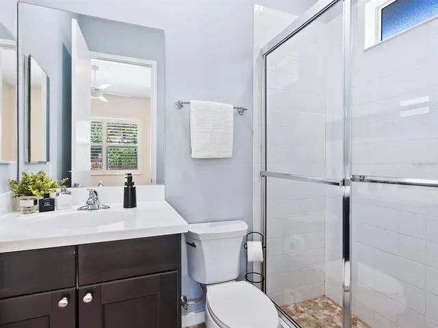 a building outdoor space with patio furniture and potted plants