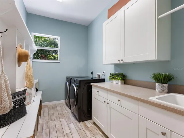 a view of a backyard with plants and a patio