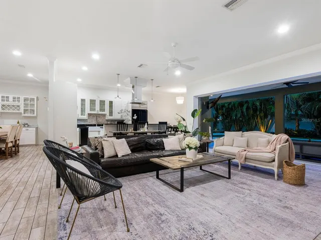 a view of an house with swimming pool and porch
