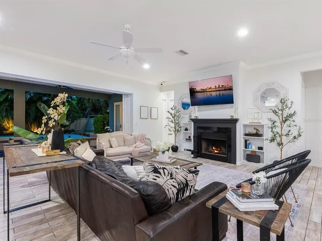 a view of a building with a patio and a water fountain