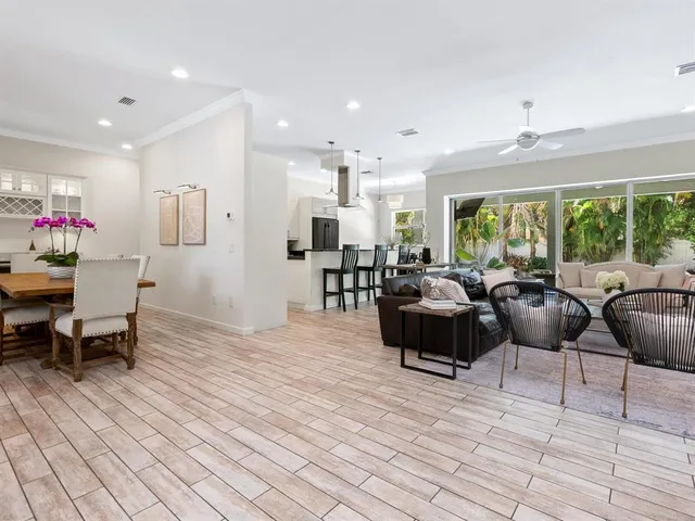 a view of a livingroom with wooden floor and a window