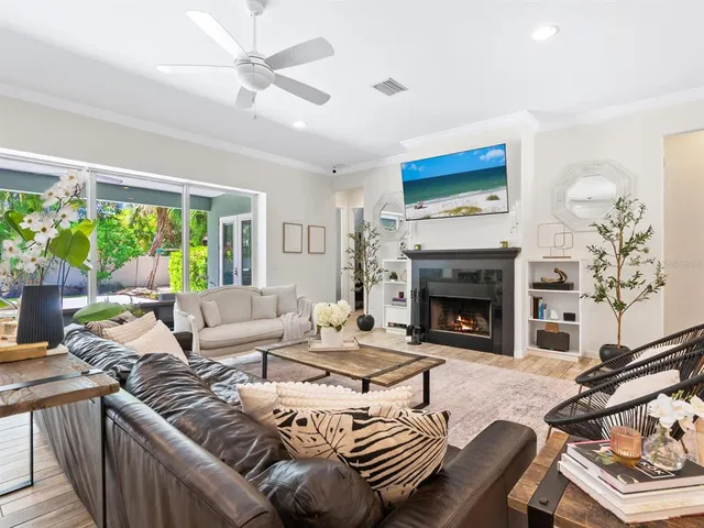 a living room with couch and a large window