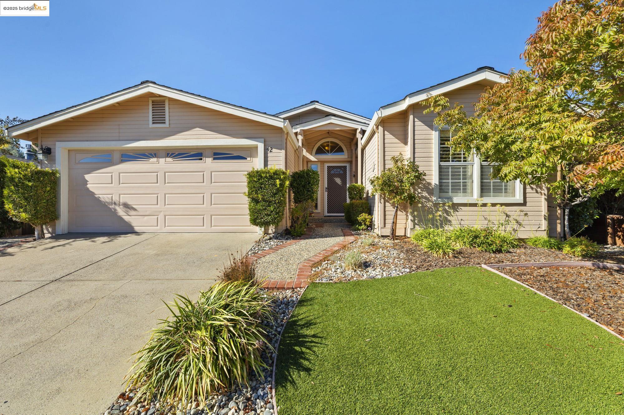 12700 Red Maple Circle, Unit 42 Sonora, CA 95370 - Photo 1 of 42 a front view of a house with garden