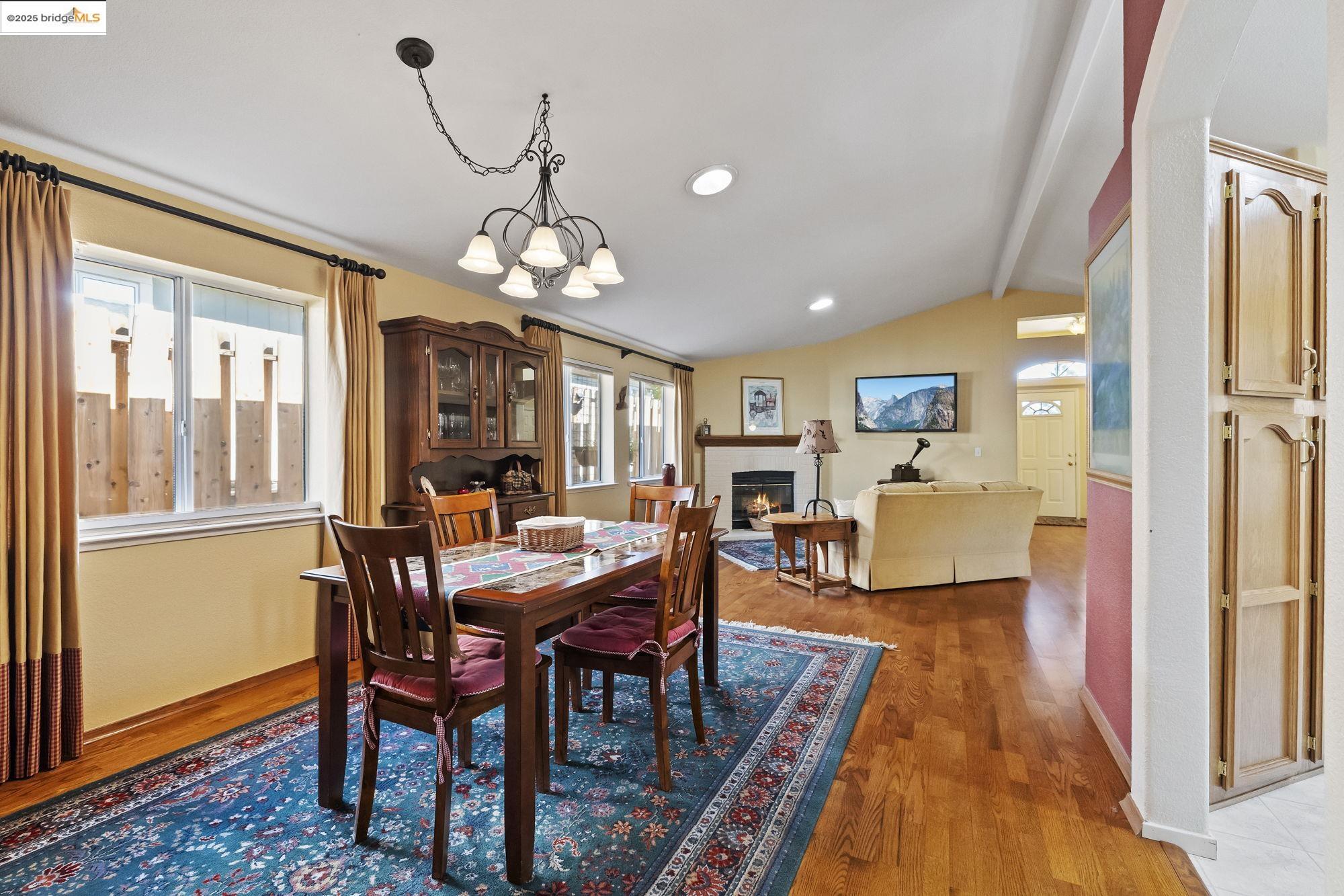 12700 Red Maple Circle, Unit 42 Sonora, CA 95370 - Photo 11 of 42 a view of a dining room with furniture window and wooden floor