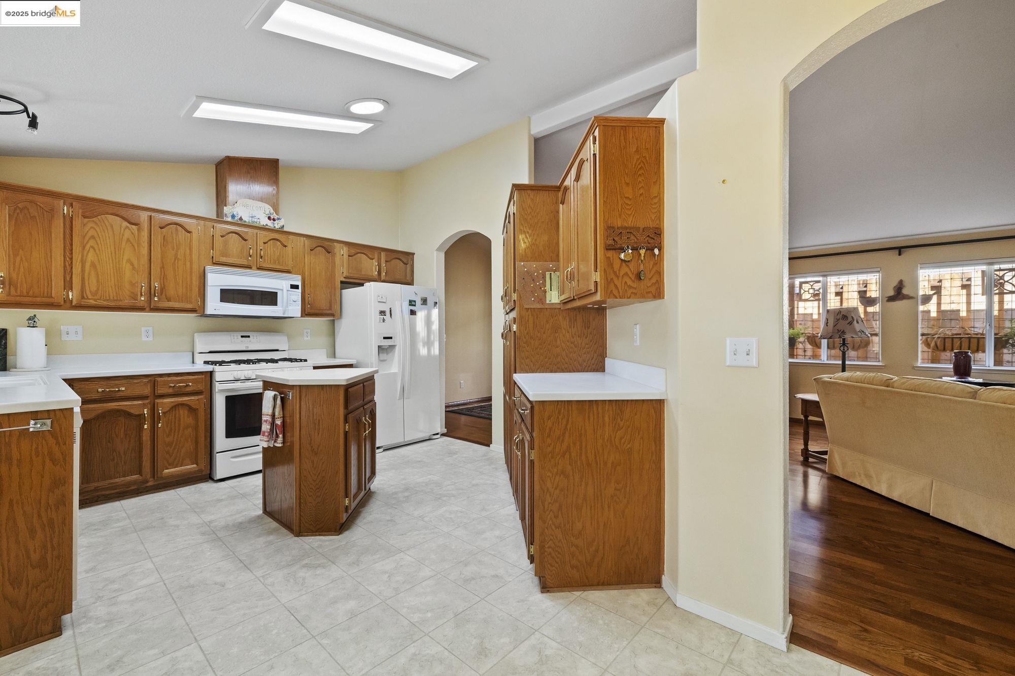 12700 Red Maple Circle, Unit 42 Sonora, CA 95370 - Photo 14 of 42 a kitchen with stainless steel appliances granite countertop a refrigerator a stove top oven a sink and dishwasher