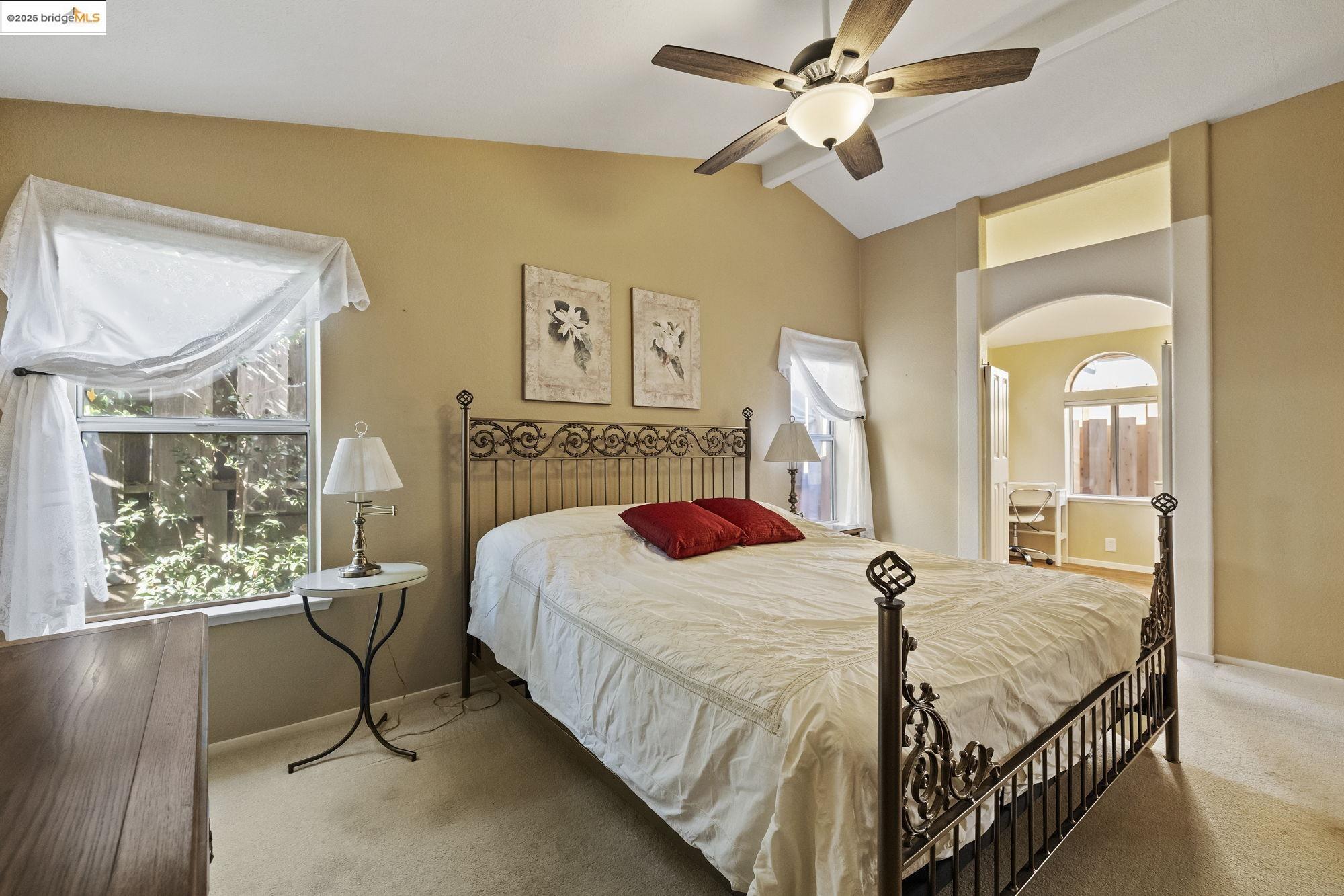 12700 Red Maple Circle, Unit 42 Sonora, CA 95370 - Photo 22 of 42 a bedroom with a bed a chandelier and dresser