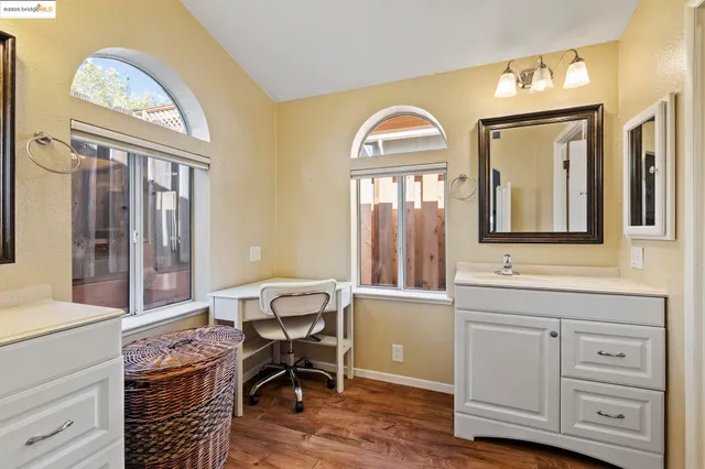 a view of a livingroom with furniture and windows