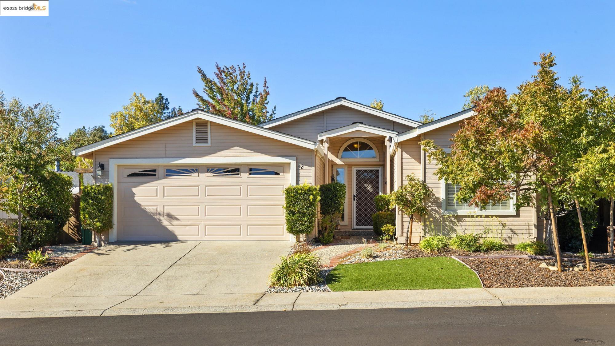12700 Red Maple Circle, Unit 42 Sonora, CA 95370 - Photo 34 of 42 a front view of a house with garden