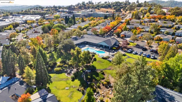 an aerial view of residential houses with swimming pool