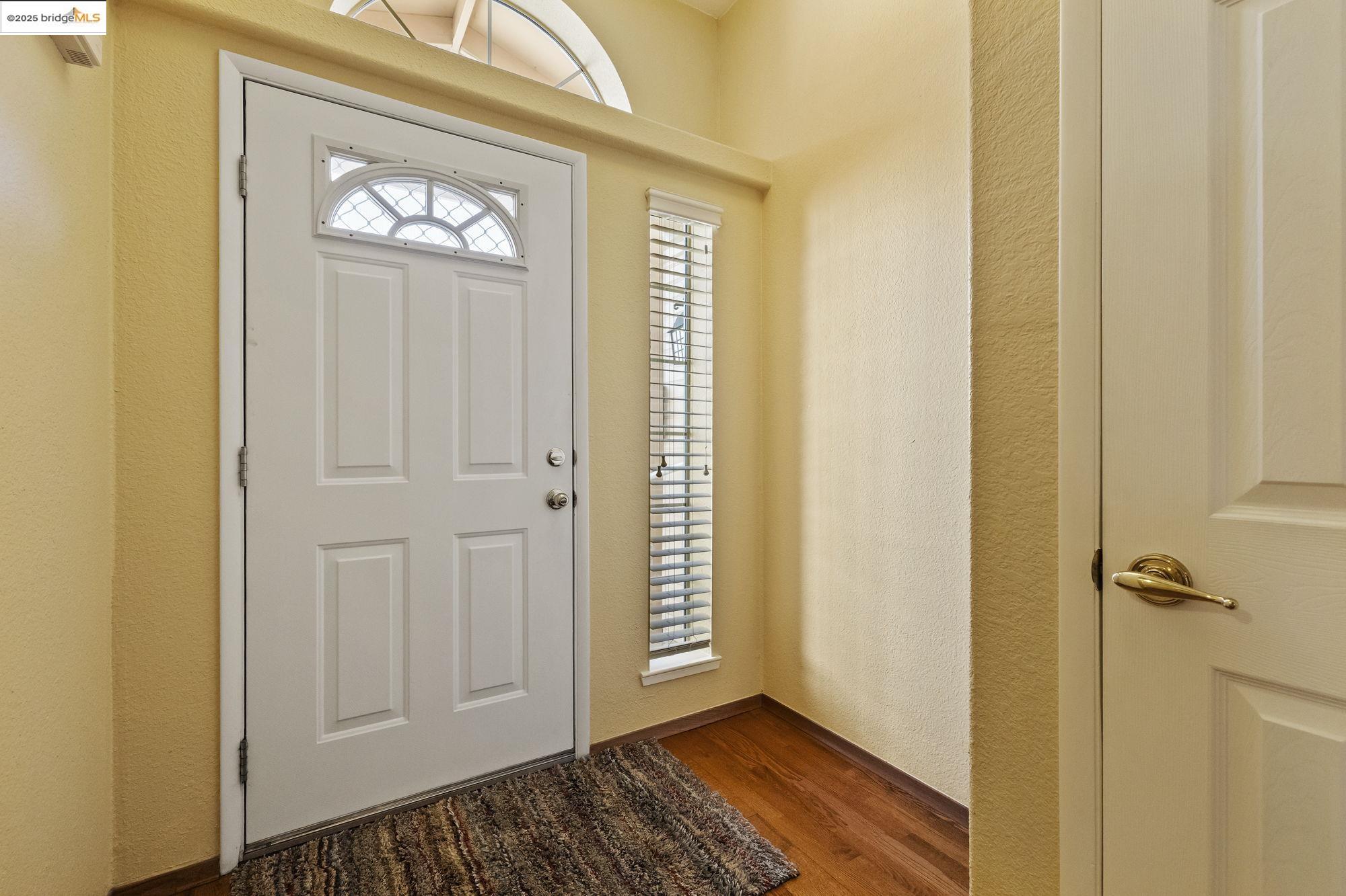 12700 Red Maple Circle, Unit 42 Sonora, CA 95370 - Photo 5 of 42 a view of a hallway with wooden floor and closet