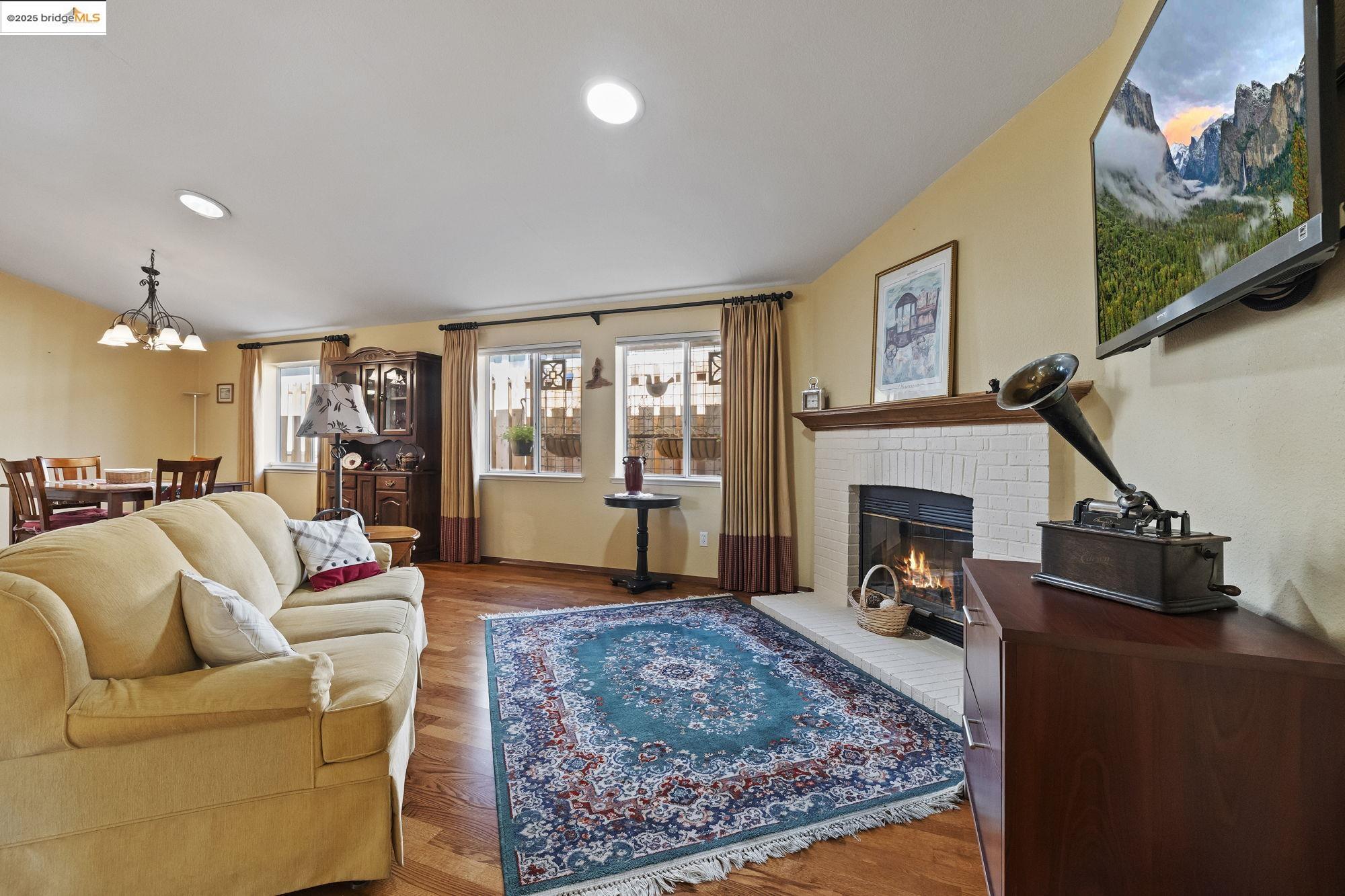 12700 Red Maple Circle, Unit 42 Sonora, CA 95370 - Photo 7 of 42 a living room with furniture or couch and a fireplace