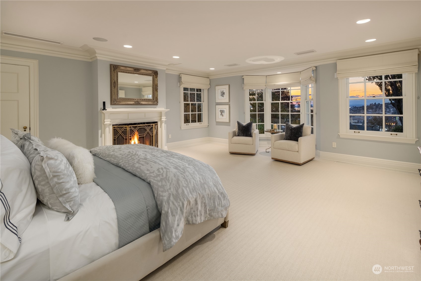 Undisclosed Address Seattle, WA 98102 - Photo 13 of 25 a spacious bedroom with a large bed and a couch