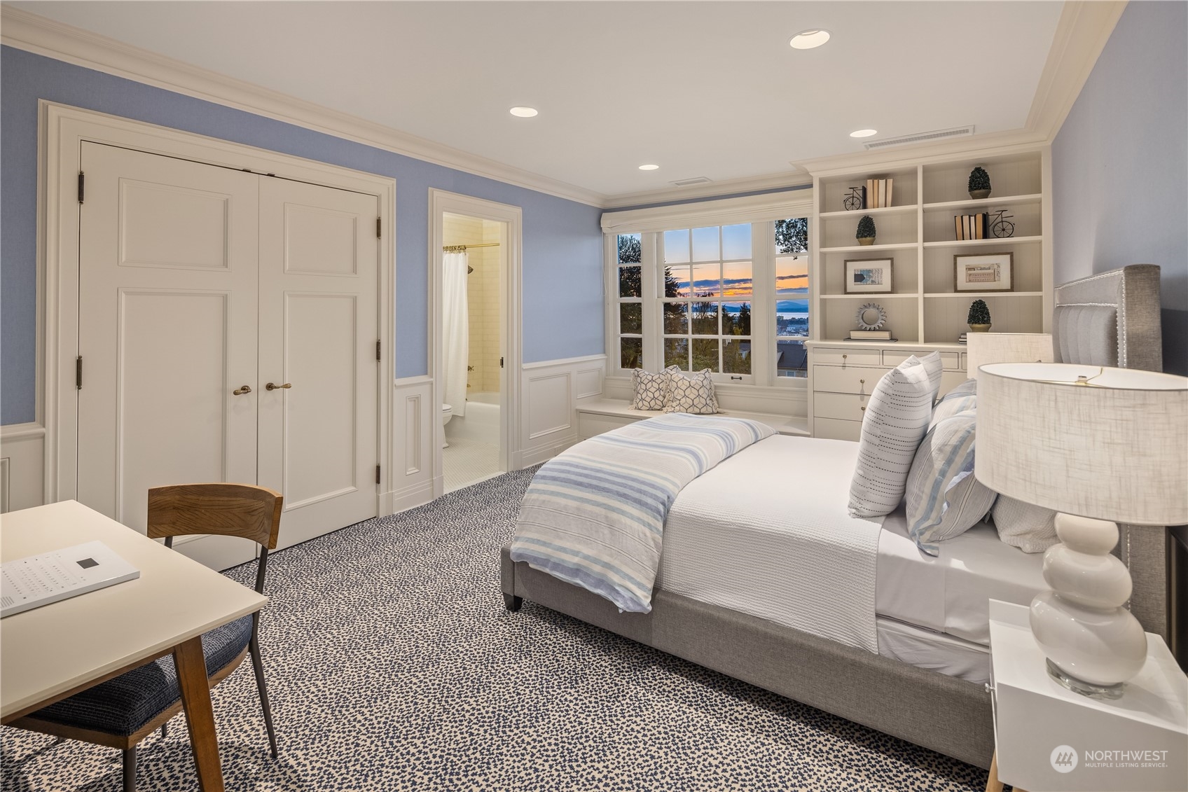 Undisclosed Address Seattle, WA 98102 - Photo 17 of 25 a bedroom with a bed and a bookshelf