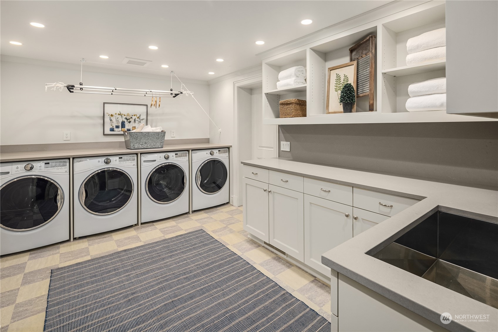 Undisclosed Address Seattle, WA 98102 - Photo 20 of 25 a kitchen with a stove top oven sink and cabinets
