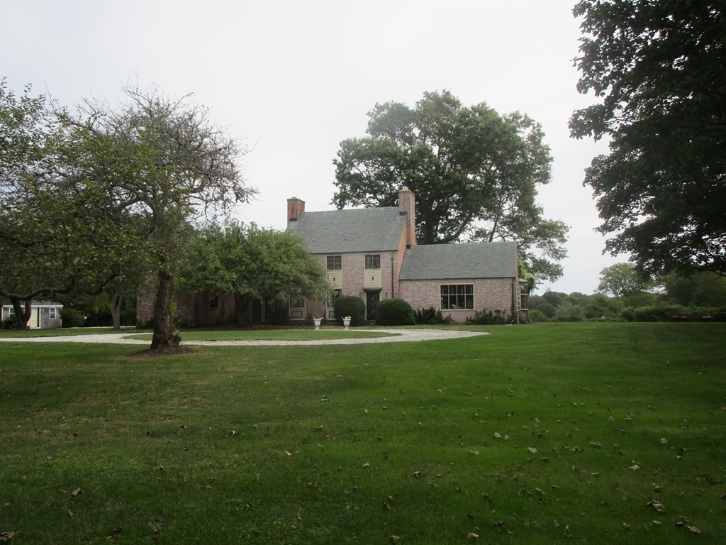 552 West Main Road Little Compton, RI 02837 - Photo 1 of 1 a front view of a house with a yard and trees