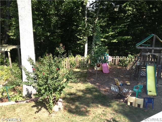 7200 Barkbridge Road Chesterfield, VA 23832 - Photo 23 of 24 a view of a backyard of a house with a fountain