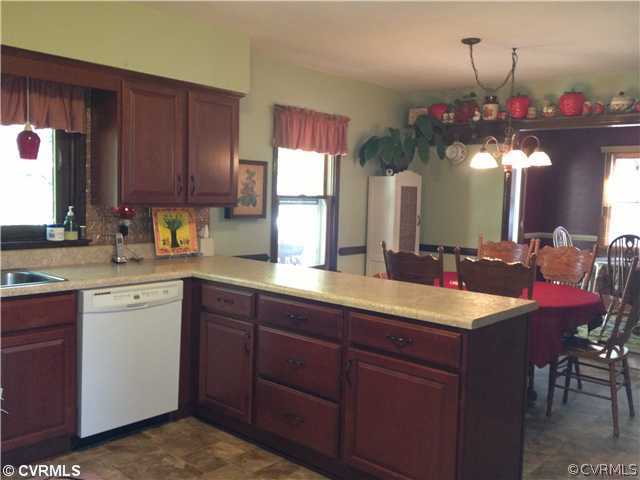 7200 Barkbridge Road Chesterfield, VA 23832 - Photo 8 of 24 a kitchen with a sink cabinets and window