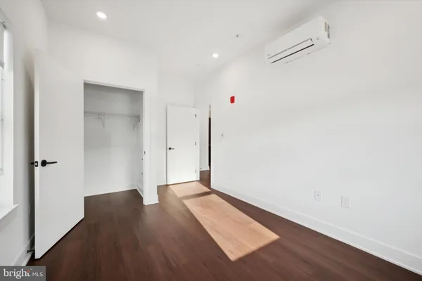 a bathroom with a shower a sink and toilet