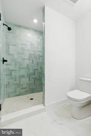 a bathroom with a bathtub and a toilet